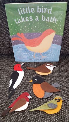 a little bird takes a bath book with cut out birds sitting on the back of a couch