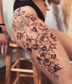 a woman's leg with flowers on it