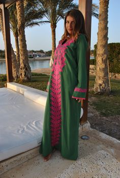 A stunning embroidered Kaftan dress that is elegant, colorful, and unique! The dress is made of Egyptian cotton that has a soft feel to it so you will surely feel comfortable and royal in it. It also comes with a small invisible pocket on the right side of the Kaftan for added practicality. You can wear this Kaftan practically anywhere and for any occasion. You can dress it up with a pair of heels and strut like an Egyptian queen in any gathering, resort, or party. Or you can dress it down with Traditional Green V-neck Tunic, Green Kaftan With Resham Embroidery For Festivals, Green Kurta With Embroidered Neckline For Eid, Traditional Green Maxi Length Kaftan, Green Traditional V-neck Dress, Traditional Green Kurta With Embroidered Neckline, Traditional Green Long Sleeve Maxi Dress, Traditional Long Sleeve Green Maxi Dress, Green Embroidered V-neck Kurta