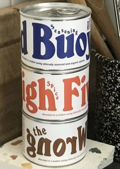 three cans of beer sitting on top of a table