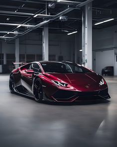 a red sports car parked in an empty parking garage with no one around the vehicle