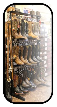 a rack full of cowboy boots and hats