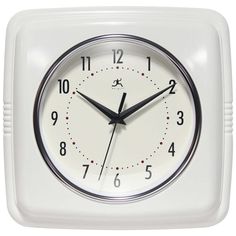 a white square clock with black hands and numbers on the face is shown in front of a white background