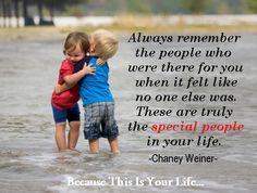 two little boys hugging each other in the water with a quote from person on it