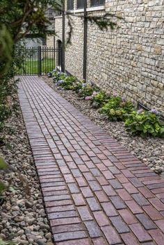 a brick walkway in front of a building