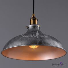 an industrial style pendant light hanging from the ceiling