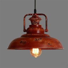 an old fashioned light hanging from the ceiling