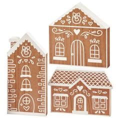 two wooden cutouts of houses with hearts and flowers on the roof, one has a door