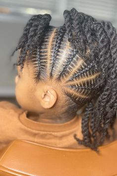 Braided Mohawk For Kids: Let your kids shine with mohawk braids for kids! These easy mohawk hairstyles for kids are fun and edgy. Perfect for mohawk braided hairstyles for black kids, these styles, including braided mohawk for black girls kids, offer a fresh look. Try cornrows mohawk hairstyles for kids or kids mohawk cornrows for a bold statement, perfect for both kids and toddlers alike....  simple cornrows for toddler girl, braided mohawk kids hair, braided mohawk black hair kids, braided mohawk on kids, braided mohawk for black girls kids Cornrows With Two Buns, Braided Hairstyles For Toddlers Black, Braid Hairstyles For Black Kids, Braid Ideas For Kids, Simple Toddler Braid Styles, Simple Cornrow Hairstyles, Mohawk Kids