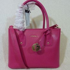 Brand New Never Been Carried Classic Josi Small Tote By Furla. This Bag Is Made Of Pink Saffiano Leather Dimensions: 10" Wide Across X 7.5" Tall Center X 4" Deep. Double Handle 4" Drop. You Can Only Carry It Over The Shoulder If You Have Small Arms. Comes With Long Detachable Shoulder Strap Center Zipper Bonus Compartment 2 Slip Pockets And 1 Zipper Pocket Furla Logo Fabric Lining. Gold Tone Metalware. Comes Complete With It's Dustbag And Care Card Furla Bags, Leather Tote Bag Women, Small Arms, Large Leather Tote Bag, Genuine Leather Totes, Large Leather Tote, Convertible Bags, Leather Handbags Tote, Care Card