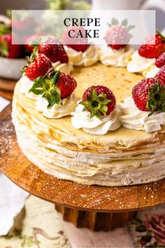 a close up of a cake with strawberries on top and the words crepe cake above it