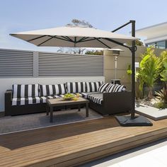 an outdoor living area with black and white striped furniture