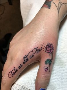 a woman's hand with a tattoo on it that says, tale as time