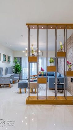 a living room filled with furniture next to a wall covered in mirrors and plants on top of it