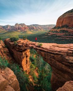 a person standing at the edge of a cliff