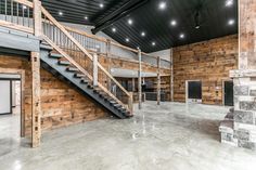 the inside of a building with wooden walls and stairs