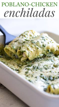 an enchilada in a casserole dish with a spoon