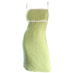 Incredibly flattering vintage late 90s (never worn) ESCADA pale green boucle dress! Marked Size 42, which translates to a US Size 12 - 14. Green and white boucle, with white trimmed bodice and shoulder straps. Looks amazing on, and was created with a heavy eye to detail! Fully lined with hidden zipper up the back, and hook-and-eye closure at the top back above zipper. Interior bust support puts everything into perfect place. Can easily transition from day to night. Great with sandals or wedges for day. Perfect with strappy heels or wedges for evening. In great unworn condition. Made in Germany. Marked Size 42 (Approximately Size 12 - 14 --Features stretch) Measurements: (slight stretch) 38-40 inch bust 34 inch waist 44-46 inch hips 39 inches from top shoulder to hem Boucle Dress, Escada Dress, Informal Dress, Princess Seam Dress, Silk Evening Gown, Leather Jacket Dress, Strapless Tube Dress, Sage Green Dress, Cocktail Dress Vintage