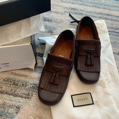 Gucci Shoes Mens Driver W Interlocking G Logo Leather Moccasins $720 Designer: Gucci Marked Size G7. Converts To Us Size 7.5 Condition: Authentic And Brand New Style Name / Number: 624699 1xh00 2140 Material: Leather, Rubber Unique Features: Classic Loafers That Are Really As Comfy As They Look. Perfect For The Smart-Casual Dress Code. Ridged Rubber Sole. Tassel Trim. Logo Plaque. Color: Rich Brown (Designer Name Is Cocoa, Please Note That Color Appearance May Vary Depending On Your Monitor Sett Designer Tassel Loafers With Rubber Sole For Business, Designer Calf Leather Moccasins With Rubber Sole, Designer Calf Leather Moccasins With Moc Toe, Designer Tassel Loafers With Branded Insole And Round Toe, Designer Slip-on Tassel Loafers For Business, Designer Business Moccasins With Brogue Detailing, Designer Calf Leather Flat Loafers, Designer Flat Calf Leather Loafers, Designer Tassel Loafers With Leather Sole