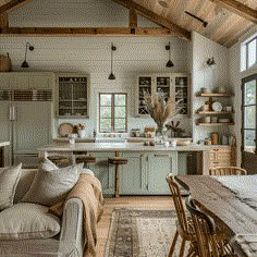 a living room filled with furniture next to a kitchen