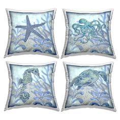 four decorative pillows with sea animals and starfishs on the bottom one is blue