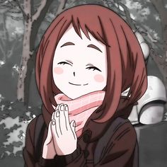 a girl with red hair is smiling and holding her hands together in front of her face