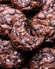 chocolate cookies with white sprinkles on a cooling rack