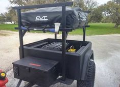 the back end of a utility vehicle with its cargo bag on it's flatbed