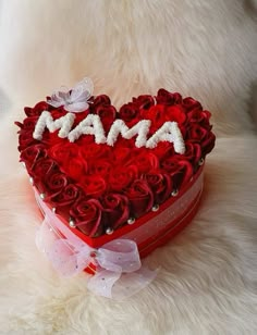 a heart shaped box with roses in the shape of a mother's day message