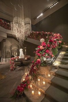 an elaborate staircase decorated with flowers and candles