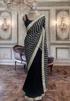 Beautiful jet black georgette saree with stitched black sleeveless blouse. Sleeveless Georgette Blouse For Party, Festive Black Pre-draped Saree With Cutdana, Elegant Black Pre-draped Saree With Mirror Work, Black Georgette Pre-draped Saree With Resham Embroidery, Unstitched Black Blouse Piece For Reception, Black Pre-draped Saree With Resham Embroidery, Black Pre-draped Saree With Pallu For Festive Occasions, Black Pre-draped Saree For Festivals With Unstitched Blouse, Black Saree With Sheer Dupatta For Reception