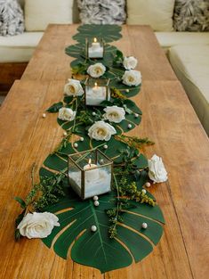 a long table with candles and flowers on it is featured in the instagram page