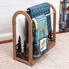 two towels are hanging on a rack in front of a wall with bookshelves