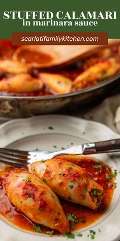 stuffed calamari in marina sauce on a white plate