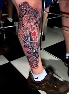 a man's leg with tattoos on it and an image of a clock in the middle