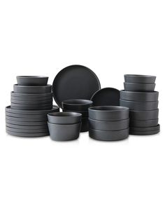 the black dishes are stacked on top of each other