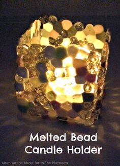 a candle holder made out of glass beads