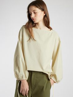 This is a modern and comfortable blouse by L’EAU that is made out of high quality fabric. With unique design detail and trendy mood, you can style it for your casual and young daily outfit.- Square neckline- Dropped shoulderline and wide armhole- Adjustable string on the sleeve- Natural volume fit Workwear Tops With Elastic Shoulders And Long Sleeves, Long Sleeve Tops With Elastic Shoulders For Work, Elastic Shoulder Long Sleeve Tops For Work, Workwear Long Sleeve Blouse With Elastic Shoulders, Long Sleeve Blouse With Elastic Shoulders For Summer, Elegant Spring Blouse With Elastic Shoulders, Chic Cream Tops With Blouson Sleeves, Relaxed Fit Tops With Blouson Sleeves For Work, Relaxed Fit Blouson Sleeve Tops For Work