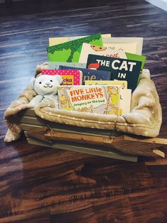 a wooden sled filled with books on top of a hard wood floor