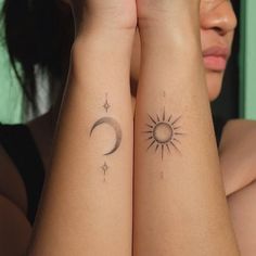 two women with matching tattoos on their arms, both have sun and moon tattoo designs