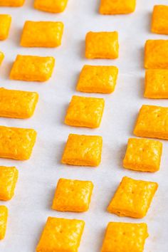 several square pieces of food sitting on top of a baking sheet