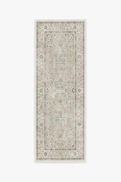 a white rug with an intricate design on it