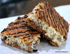 two pieces of cake with chocolate drizzled on top