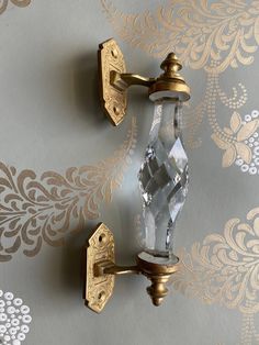 two wall sconces on the side of a wall