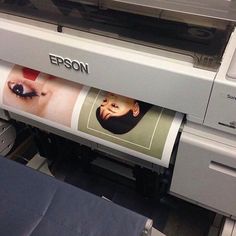 an epson printer with the image of a baby's face being printed on it