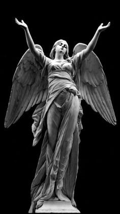 an angel statue is shown in black and white