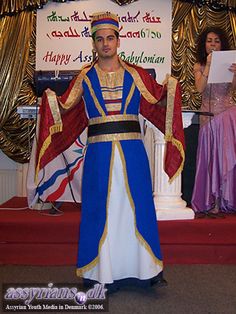 a man dressed in costume standing on stage