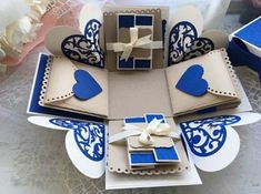 an open card with blue and white designs on it, sitting on top of a table