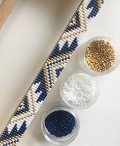 three different types of beading next to each other on a white table with scissors