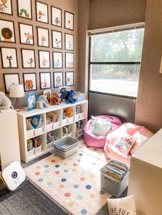 a child's room with lots of toys and pictures on the wall